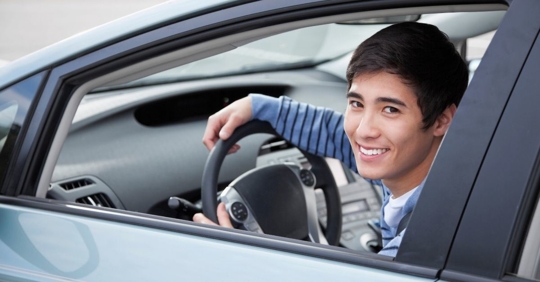 young driver in the driver's seat